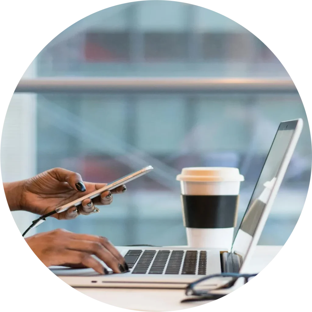 person using phone and computer